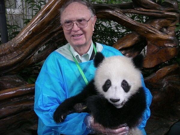 gil bane holding a small panda