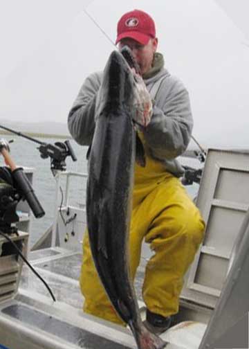 Jesse Mickelson holding a king salmon