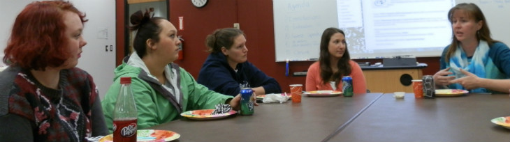 4 students seated with instructor Jessica Skonberg 