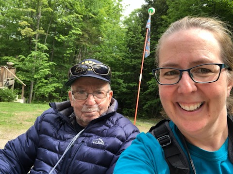 cindy trussell posing for a selfie with her mustached, gray haired father