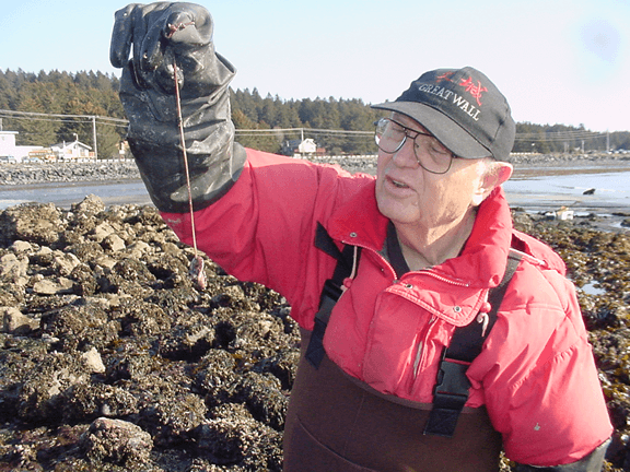gil bane holding a specimen from a tidepool