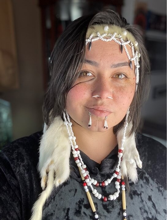 a headshot of Hanna Sholl wearing Alutiiq beads and headband