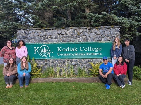 kodiak collete student government in front of the Kodiak College sign on campus