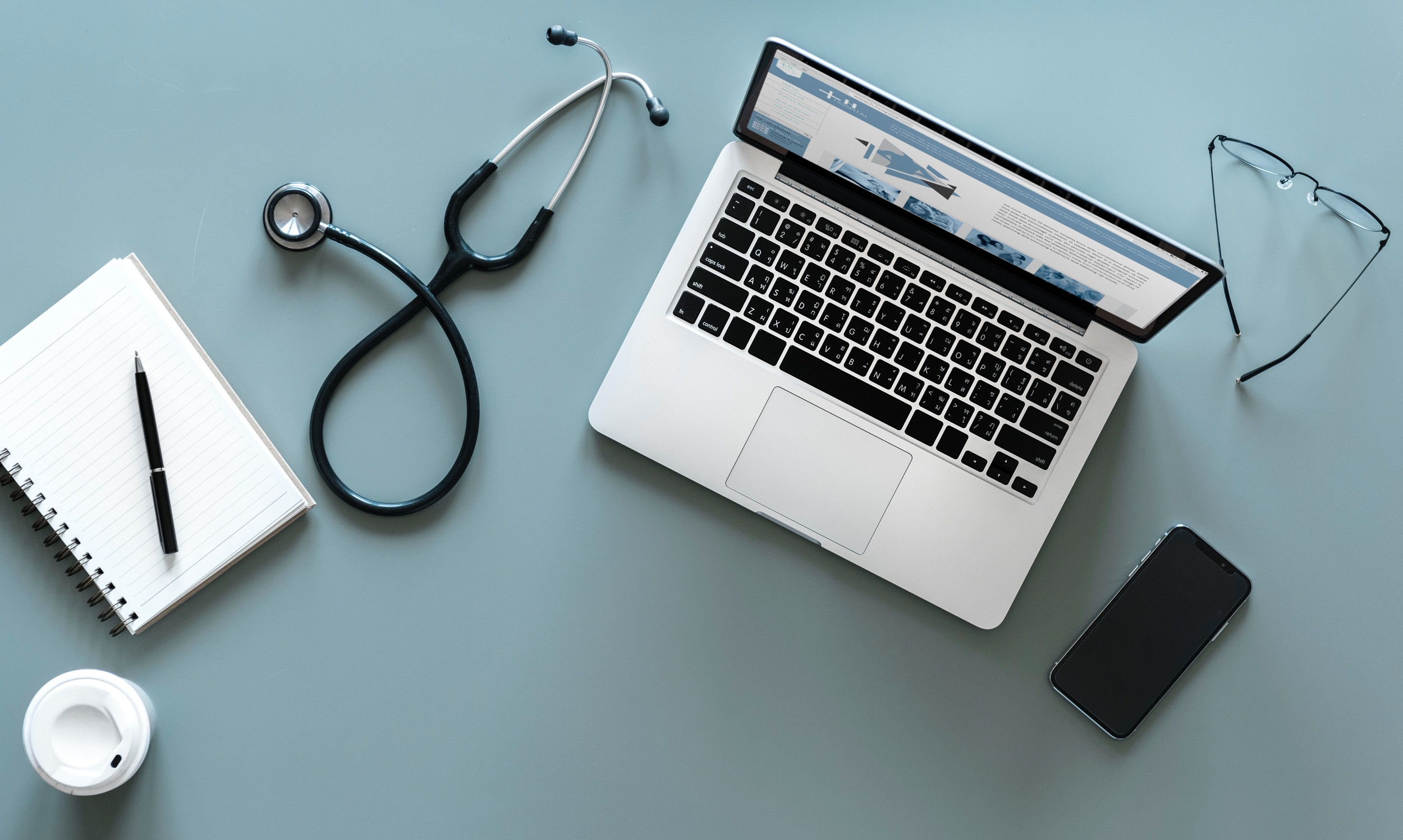 stethescope and office supplies on a desktop