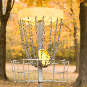 disc golf basket with a disc in it