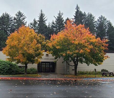 trees in fall colors in front of Kodiak College