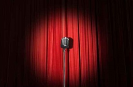 microphone in front of a red curtain