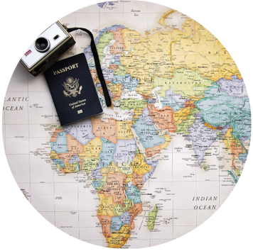 map with a passport and camera on top