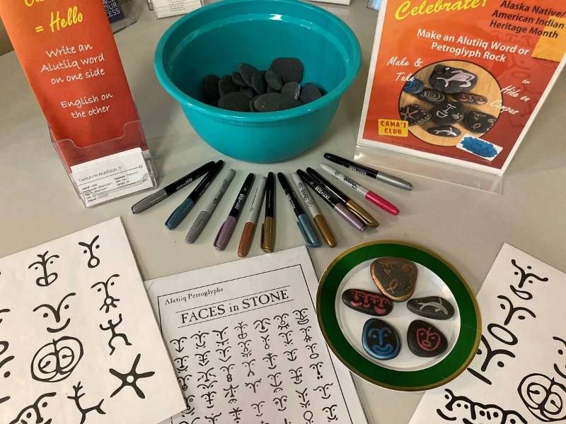 Pens, rocks, and petroglyph images.