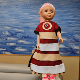 a doll in homemade Alutiiq regalia