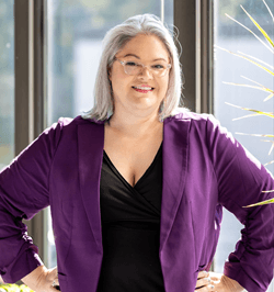 jacelyn keyes wearing a black shirt and purple blazer