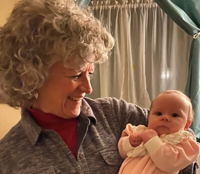 Kitty Deal holding and infant