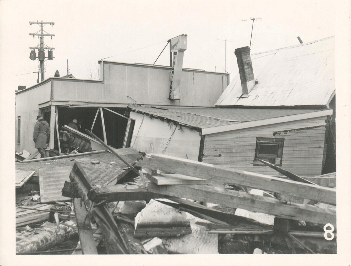 photograph of wooden buildings downtown destroyed by the tsunami